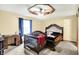 Bedroom featuring dark-stained wood accents, an antique vanity, and ceiling fan at 926 Brookside Ln, Plainfield, IN 46168
