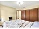 Bedroom featuring a full sized bed, closet and doorway to another room, with light colored walls at 926 Brookside Ln, Plainfield, IN 46168
