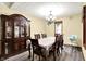 Elegant dining room featuring wood floors, modern chandelier, and antique china cabinet at 926 Brookside Ln, Plainfield, IN 46168