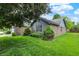 Well-manicured lawn with decorative shrubs enhance this home's curb appeal at 926 Brookside Ln, Plainfield, IN 46168