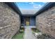 Charming front entrance with brick walls and a walkway leading to the front door at 926 Brookside Ln, Plainfield, IN 46168