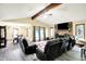 Open-concept living and dining areas with a brick fireplace and modern flooring at 926 Brookside Ln, Plainfield, IN 46168