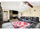 Cozy living room with brick fireplace, vaulted ceiling, and comfortable seating at 926 Brookside Ln, Plainfield, IN 46168