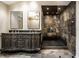 Stunning bathroom with custom double vanity, glass-enclosed shower, and slate tile at 9550 Copley Dr, Indianapolis, IN 46260