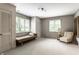 Neutral bedroom featuring a daybed near window, complementing the carpet and walls at 9550 Copley Dr, Indianapolis, IN 46260