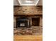 Close-up of a brick fireplace with a wooden mantel, adding warmth and character to the living space at 9550 Copley Dr, Indianapolis, IN 46260