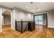 Upper hallway featuring hardwood floors, classic railings, and access to various rooms throughout the house at 9550 Copley Dr, Indianapolis, IN 46260