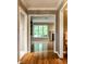 Hallway view leading to a bright living room, highlighting the home's natural light and open feel at 9550 Copley Dr, Indianapolis, IN 46260