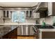 This efficient kitchen has a stainless steel stove, dishwasher and sink and a stylish island for prepping meals at 9550 Copley Dr, Indianapolis, IN 46260