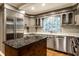 This kitchen has updated appliances, sleek countertops, and ample cabinet space, making it a chef's dream at 9550 Copley Dr, Indianapolis, IN 46260