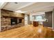 Inviting living room featuring a brick fireplace and an open layout to the kitchen, perfect for gatherings at 9550 Copley Dr, Indianapolis, IN 46260