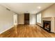 Living room with hardwood floors, fireplace, built in bookcase, and plenty of light at 9550 Copley Dr, Indianapolis, IN 46260