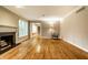 Spacious living room features hardwood floors, a fireplace, and a comfortable armchair at 9550 Copley Dr, Indianapolis, IN 46260