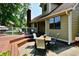 Enjoy outdoor dining on the back patio featuring a grill, comfortable seating, and a spacious deck for entertaining at 1010 Lakewood N Dr, Brownsburg, IN 46112