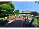 Spacious back patio featuring dining and lounge areas, grill, and comfortable seating for outdoor entertainment and relaxation at 1010 Lakewood N Dr, Brownsburg, IN 46112