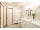 Stylish bathroom with a double vanity, framed mirrors, and tile flooring at 1010 Lakewood N Dr, Brownsburg, IN 46112