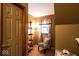 Cozy bedroom nook with a zebra print chair, floor lamp and ladder shelf at 1010 Lakewood N Dr, Brownsburg, IN 46112
