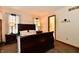 Comfortable bedroom with dark wood furniture and soft, neutral décor at 1010 Lakewood N Dr, Brownsburg, IN 46112