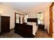 Comfortable bedroom with ample natural light, dark furniture, and a serene atmosphere at 1010 Lakewood N Dr, Brownsburg, IN 46112
