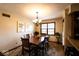 Inviting dining room featuring a chandelier, large table, and a window providing natural light at 1010 Lakewood N Dr, Brownsburg, IN 46112