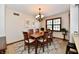 Elegant dining room featuring a chandelier, dining table and rug at 1010 Lakewood N Dr, Brownsburg, IN 46112