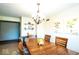 The dining room features a wooden table, chandelier, and decor at 1010 Lakewood N Dr, Brownsburg, IN 46112