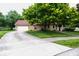 Charming home with attached garage, covered porch, and well-maintained landscaping enhancing curb appeal at 1010 Lakewood N Dr, Brownsburg, IN 46112