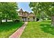 Charming two-story home with brick walkway and well-manicured front yard at 1010 Lakewood N Dr, Brownsburg, IN 46112