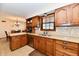 Kitchen with wood cabinets, granite countertops and stainless steel appliances at 1010 Lakewood N Dr, Brownsburg, IN 46112