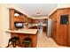 Traditional kitchen featuring wood cabinets, modern appliances, and a breakfast bar with seating at 1010 Lakewood N Dr, Brownsburg, IN 46112