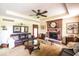 The home's spacious living room features a red brick fireplace, and comfortable seating at 1010 Lakewood N Dr, Brownsburg, IN 46112