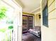 Cozy porch featuring a swing seat with cushions, and large window for natural light at 1010 Lakewood N Dr, Brownsburg, IN 46112
