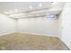 Bright finished basement with recessed lights, tile floors and glass block window at 10245 Briar Creek Ln, Carmel, IN 46033