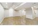 Spacious basement featuring bright lighting, tile floor, and white painted walls at 10245 Briar Creek Ln, Carmel, IN 46033