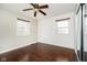 Bedroom featuring wood floors, natural light, a ceiling fan, and a sliding-door closet at 10245 Briar Creek Ln, Carmel, IN 46033