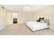 Large bedroom with neutral carpet, light walls, and a bathroom en suite at 10245 Briar Creek Ln, Carmel, IN 46033