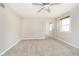 Bedroom with neutral walls, carpet flooring, and a sliding-door closet at 10245 Briar Creek Ln, Carmel, IN 46033