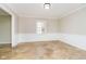 Bright dining room with tan tile floors, white wainscoting, and a single window at 10245 Briar Creek Ln, Carmel, IN 46033