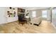 Inviting living room with brick fireplace, built-in shelving, light wood floors, and lots of natural light at 10245 Briar Creek Ln, Carmel, IN 46033