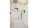 Shower featuring tiled walls, a rain shower head, and built-in shelves at 10245 Briar Creek Ln, Carmel, IN 46033