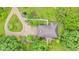 An aerial perspective highlights the garden surroundings and the gravel driveway that leads to this home at 10444 N State Road 9, Fountaintown, IN 46130
