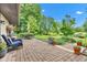 Enjoy outdoor living on the brick patio with comfortable seating and a lush green backyard at 10444 N State Road 9, Fountaintown, IN 46130