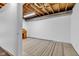 Expansive unfinished basement area showcasing exposed ceiling beams and open layout with a small desk at 10444 N State Road 9, Fountaintown, IN 46130