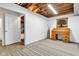 Finished basement area offers versatile space and decor with a vintage desk for work or hobbies at 10444 N State Road 9, Fountaintown, IN 46130