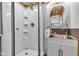 Updated bathroom featuring a glass shower with white tile and modern fixtures at 10444 N State Road 9, Fountaintown, IN 46130