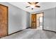 Bedroom featuring carpeted floors and a door to the bathroom at 10444 N State Road 9, Fountaintown, IN 46130
