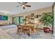 Bright dining area with wood table, natural light, and views of the outdoor space at 10444 N State Road 9, Fountaintown, IN 46130