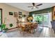 Lovely dining room features a wooden table with access to a patio and picturesque backyard at 10444 N State Road 9, Fountaintown, IN 46130