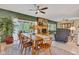 Spacious dining area with wood furniture, fireplace, and access to outdoor balcony at 10444 N State Road 9, Fountaintown, IN 46130