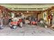 Garage interior featuring tractors, lawn equipment and storage at 10444 N State Road 9, Fountaintown, IN 46130